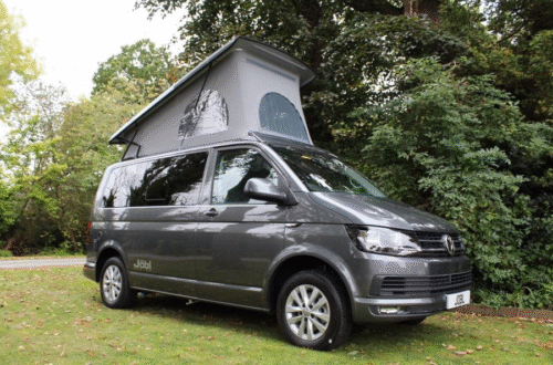 Traveler overlooking a quiet Scottish landscape after exploring popular tourist attractions in Scotland