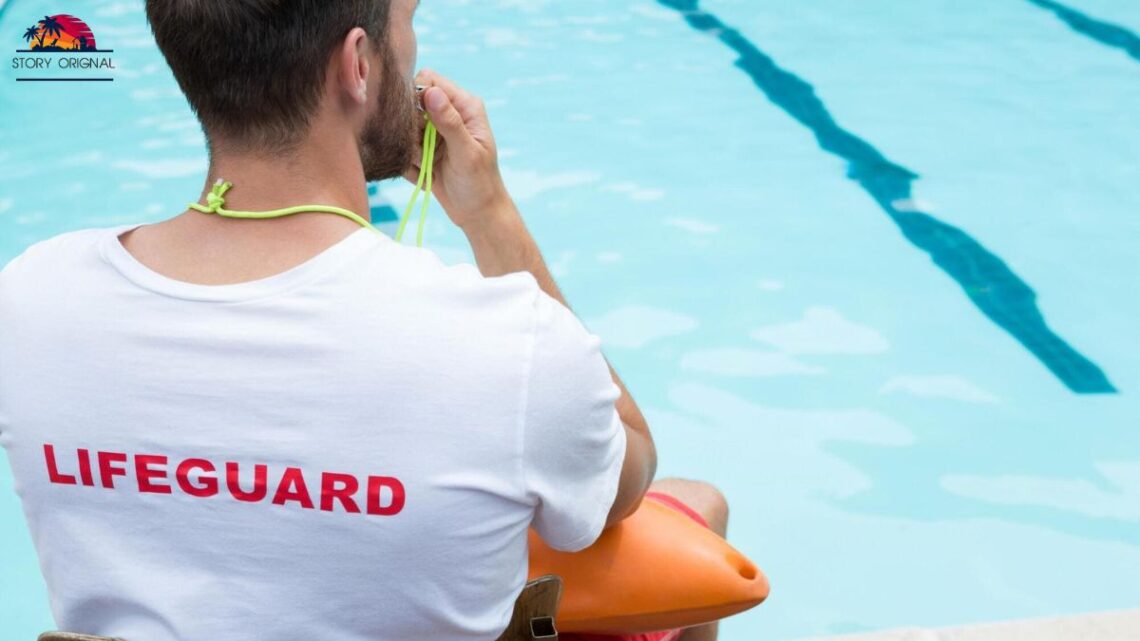 Professional lifeguard watching over swimmers at a busy beach, ensuring safety and quick response.